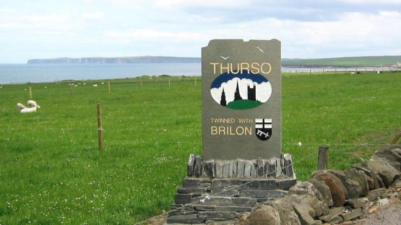 Civilisation - and the distant cliffs of Dunnet Head.