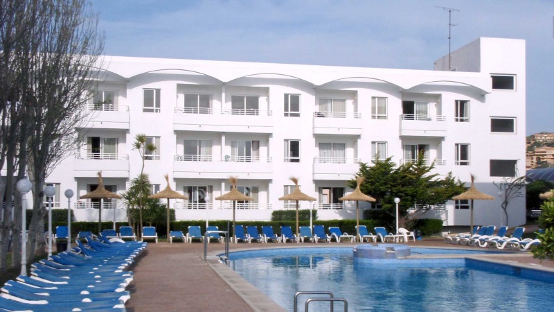 The Hobby Club Apartments block and pool-side.